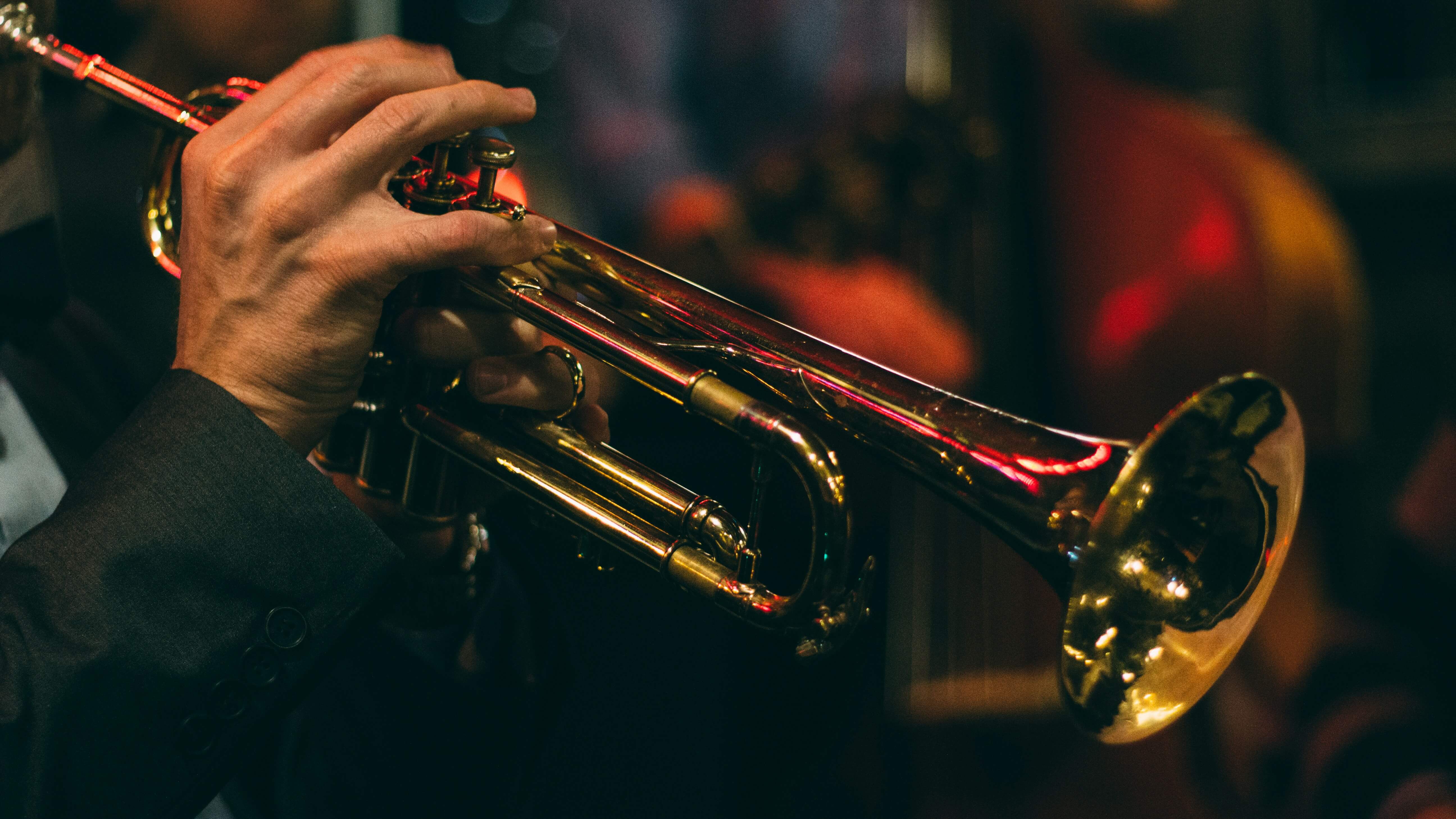 a musician playing a trumpet in a jazz band