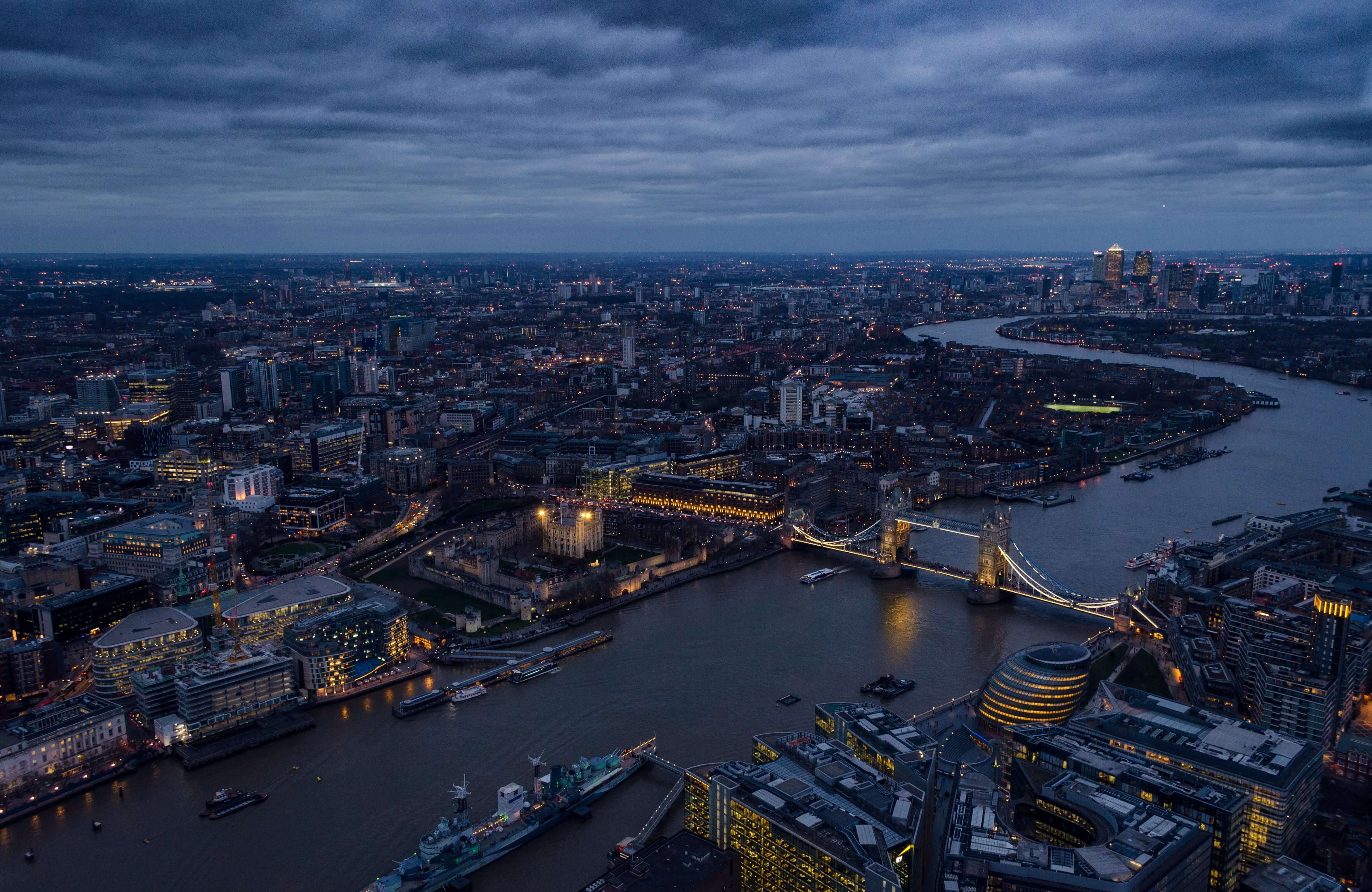 a view of London over the river at night