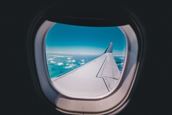 the wing of an aeroplane seen from a window