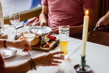 an escort and a client in a restaurant on a date