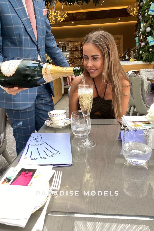Aira at her favourite restaurant getting champagne poured for her 